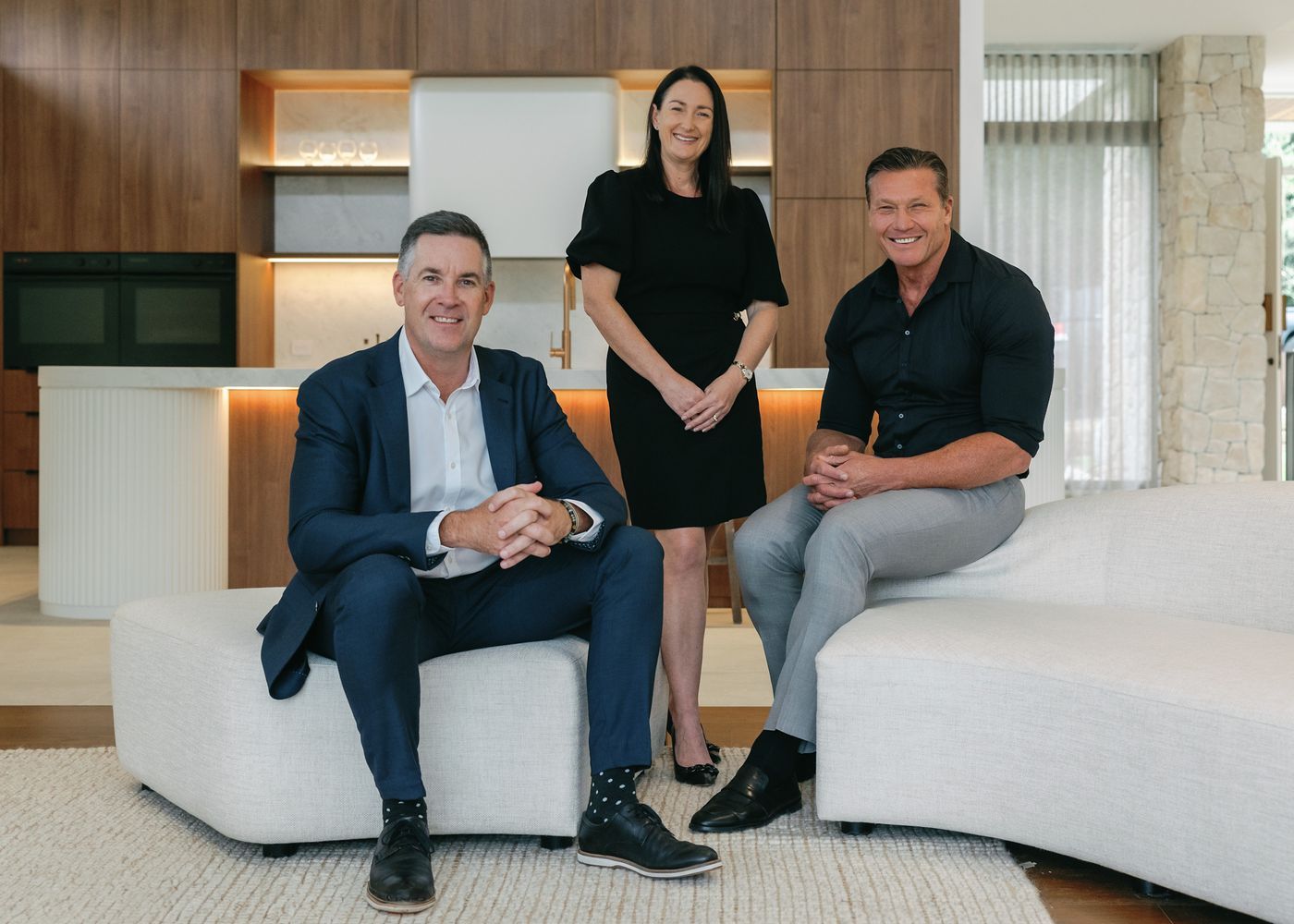 Mat Steinwede and Jaimie Woodcock celebrate a milestone as McGrath’s 1st franchisees - extending their reach to Newcastle and Lower Hunter